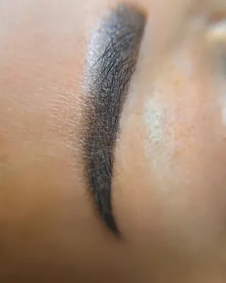 A healed brow in close up, showing the powder finish