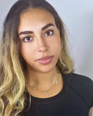 A client facing camera with her healed brows