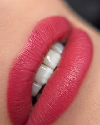 Healed lips in a bold red, close up
