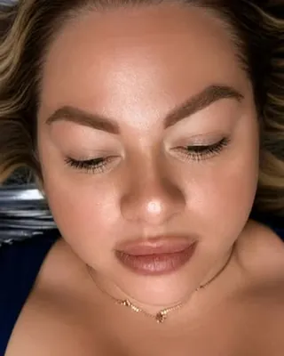 Healed brows and a nude lip, eyes closed