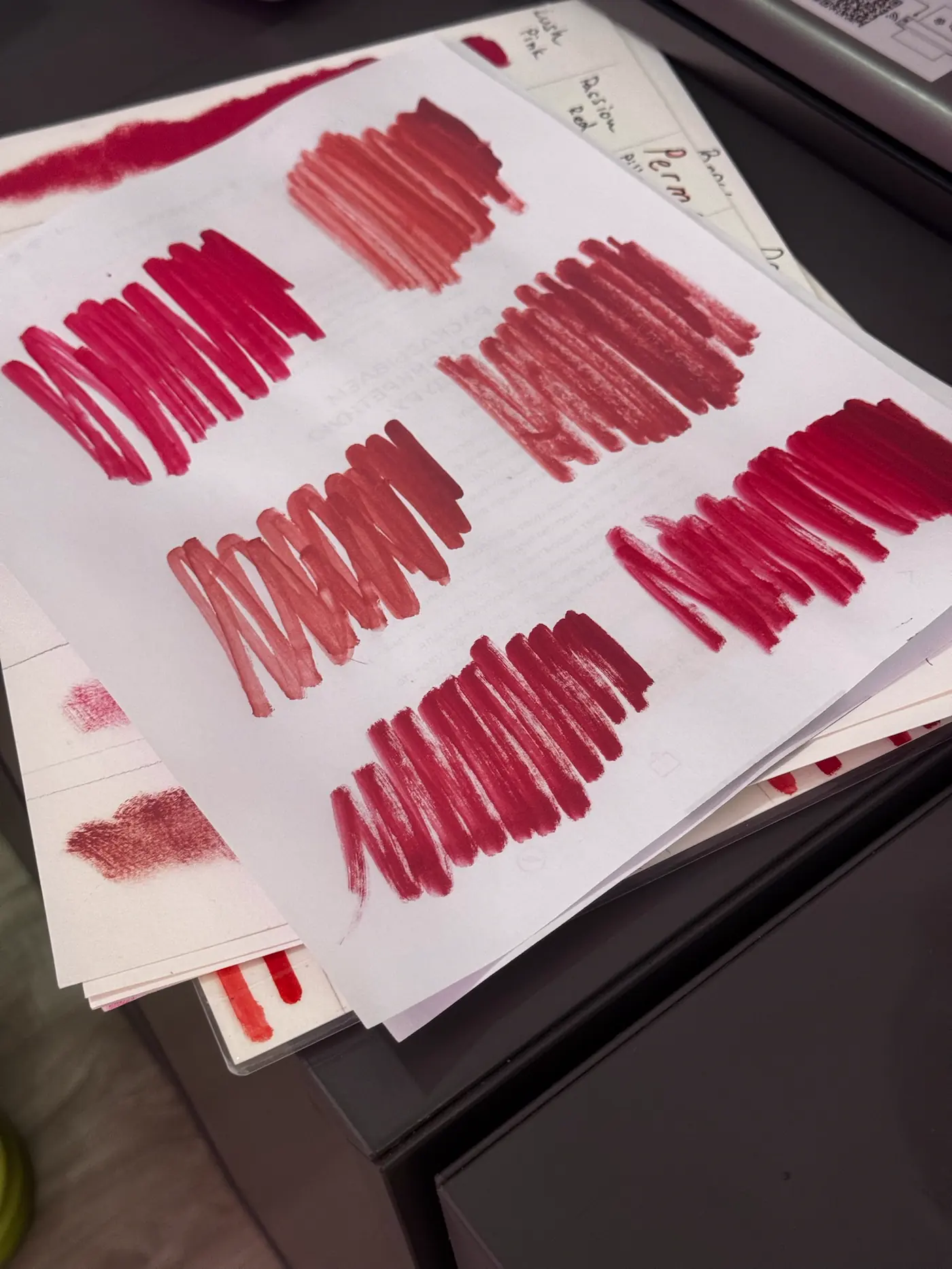 Hand-drawn pigment swatch sheets used to match brow color to hair and skin