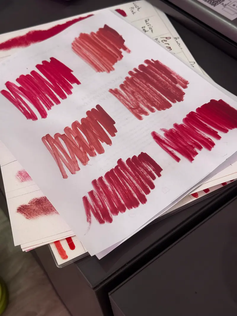 Hand-drawn pigment swatch sheets used to match a client's shade